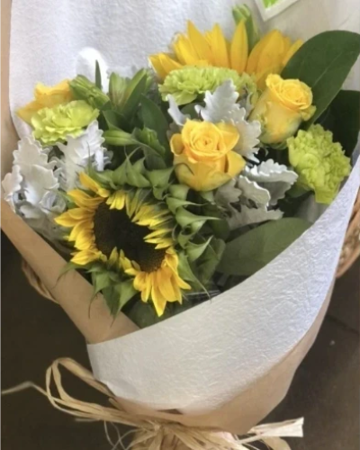 Myles of Smiles - This bouquet is a great gift for those with pets, Sunflowers and Carnations are the main flowers used to create this bouquet.