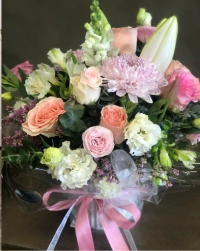 Jill's Classic - A classic arrangement of timeless blooms, perfect for any occasion. Presented in a sophisticated vase, it’s a versatile choice for any setting.