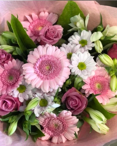 Bouquet of The Day - A charming arrangement featuring a lovely combination of soft pink blooms and lush greenery. Tied with a delicate ribbon, it's perfect for expressing love and admiration on any special occasion.