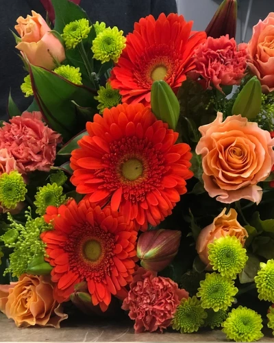 Kassandra Bouquet - Rich orange and red blooms, this bouquet features warmth in any setting.