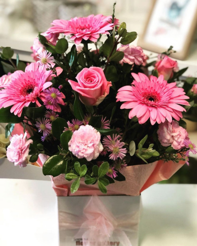 Nan's Choice Box Arrangement - This box arrangement is filled with vibrant pink flowers. It's a delightful choice for adding a pop of colour to any room.