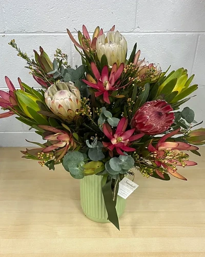 Native Delights - A timeless arrangement featuring lush native flowers. The versatile design makes it a perfect gift for any occasion.